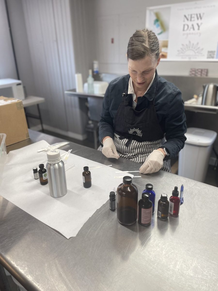 Skincare maker mixing product during a New Day Organics brand film shoot